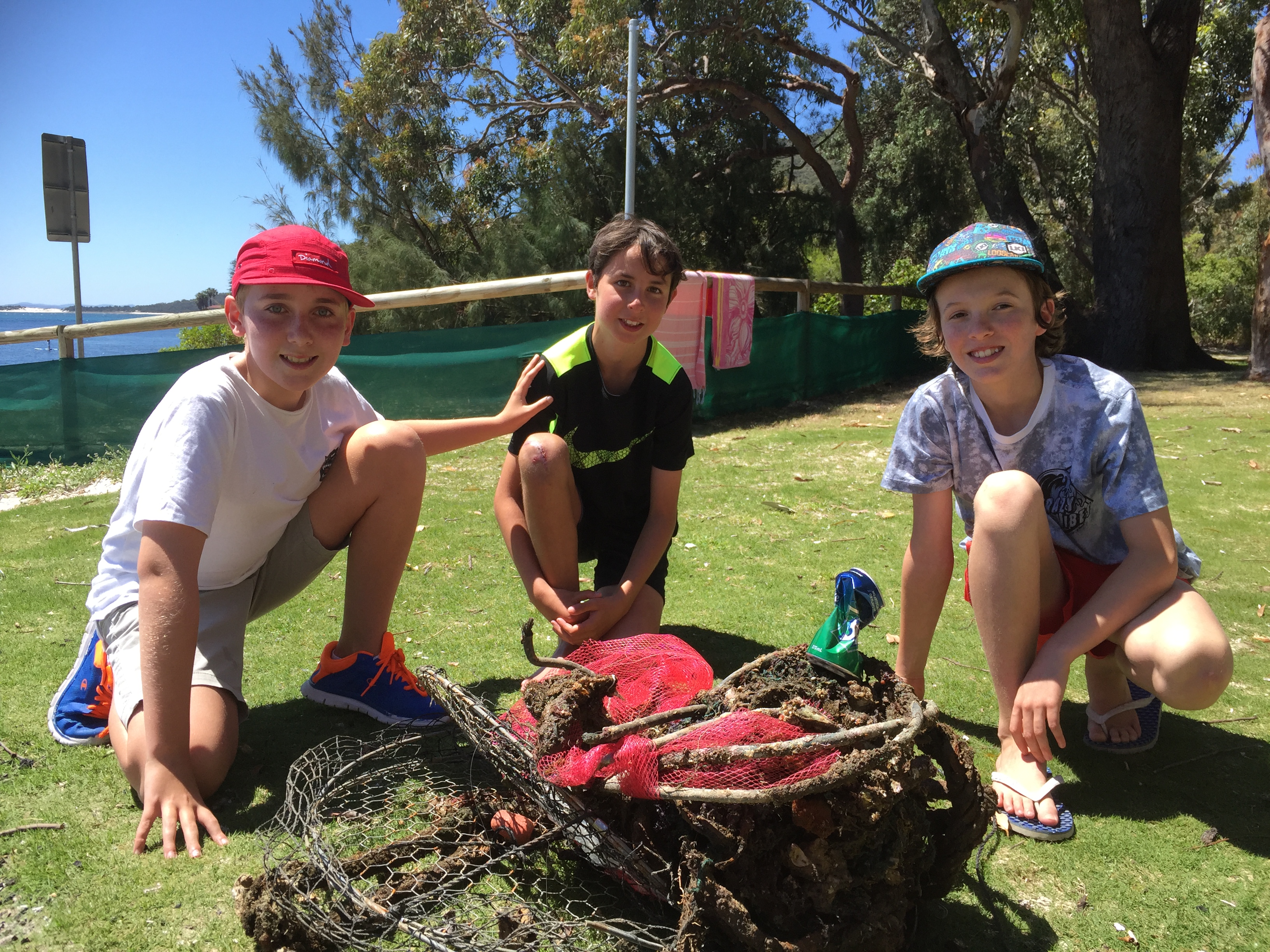 Oscar Bell, Samuel Finn and Troy Voyzey with rubbish collected from Nelson Bay Breakwall.