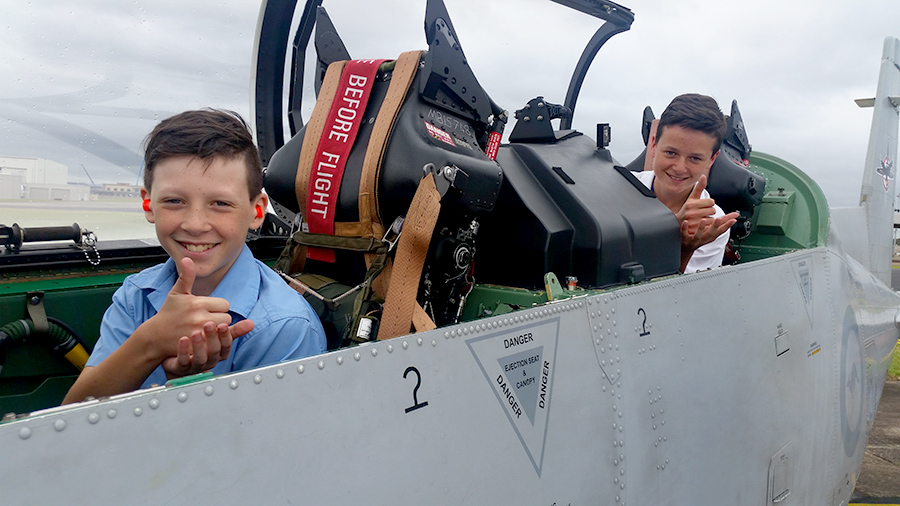 Josiah Hays, 10 and Ethan Hays, 13 in the seat of a Pilatus PC9 flown by 4SQN aircraft.