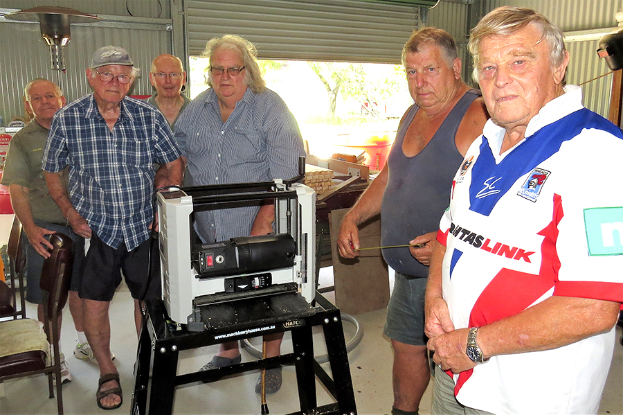 MEN’S SHED: Peter Millen, Jim Brown, Max Burrows, Neville Wing, Garry Haynes and Rodney Costall test the new Thicknesser.