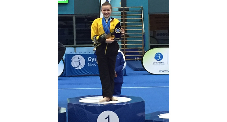 Emily on the first place podium at her recent competition.