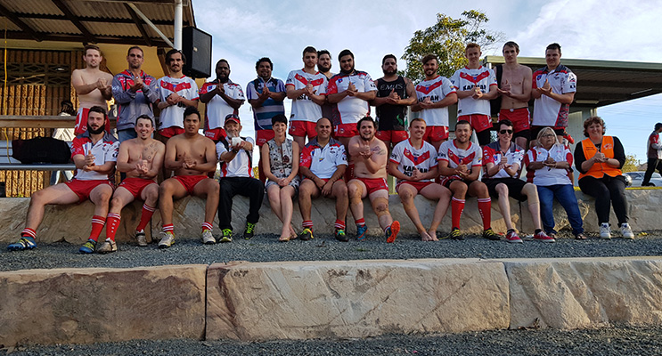 KARUAH SPORTS OVAL: Kate Washington MP front and centre with the Karuah Roos Rugby League Team.