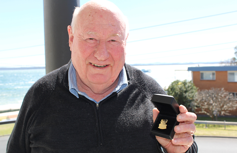 Allan Bell with his Newcastle Knights Life Membership medal.