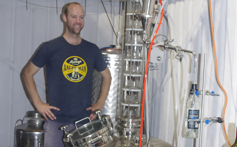 Sean Costigan working on the new distillery. Photo by Marian Sampson.