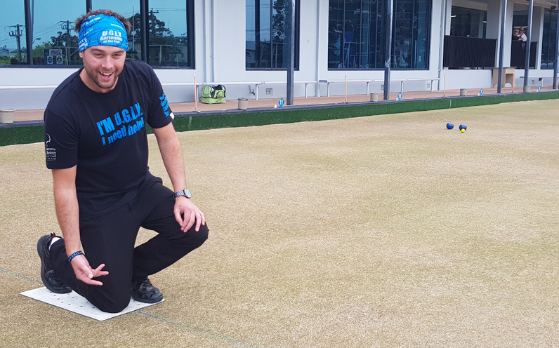 Michael Sercombe, Nelson Bay Bowling Clubs Operations Manager getting into barefoot bowls.