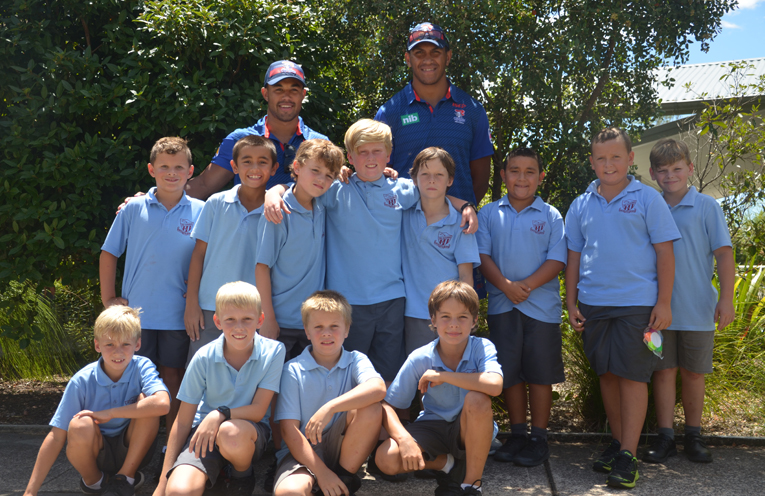 KNIGHTS VISIT: NRL’s Jacob Saifiti and Christian Hazard with Tea Gardens Primary School Students.