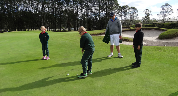 YOUNG GOLFERS: Bobs Farm students receiving putting tips